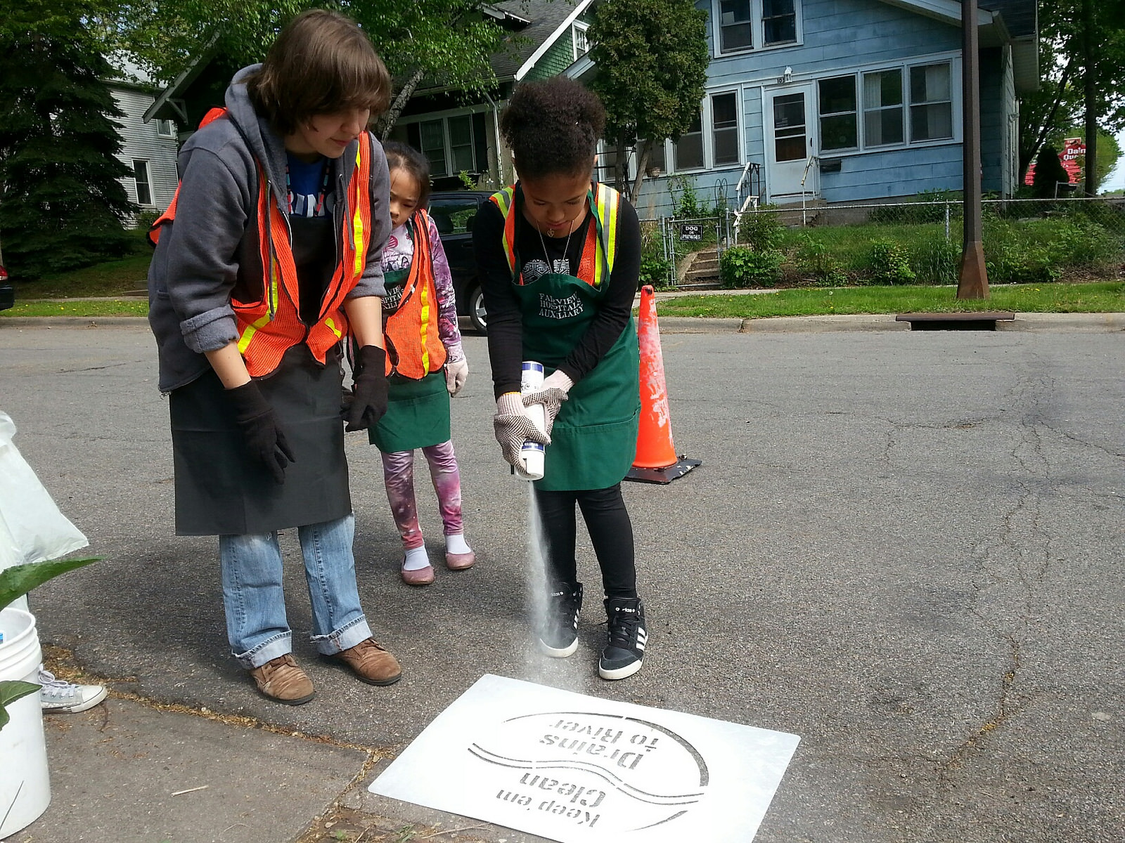 Let's spray paint storm drains for the Mighty Mississippi!