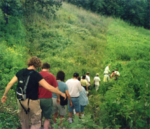 [Photo: Hikers head into the Prairie Bowl]