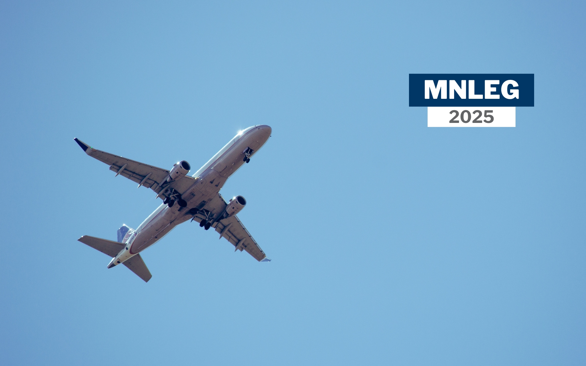 A plane flying against a blue sky. Text says "MNLEG 2025"