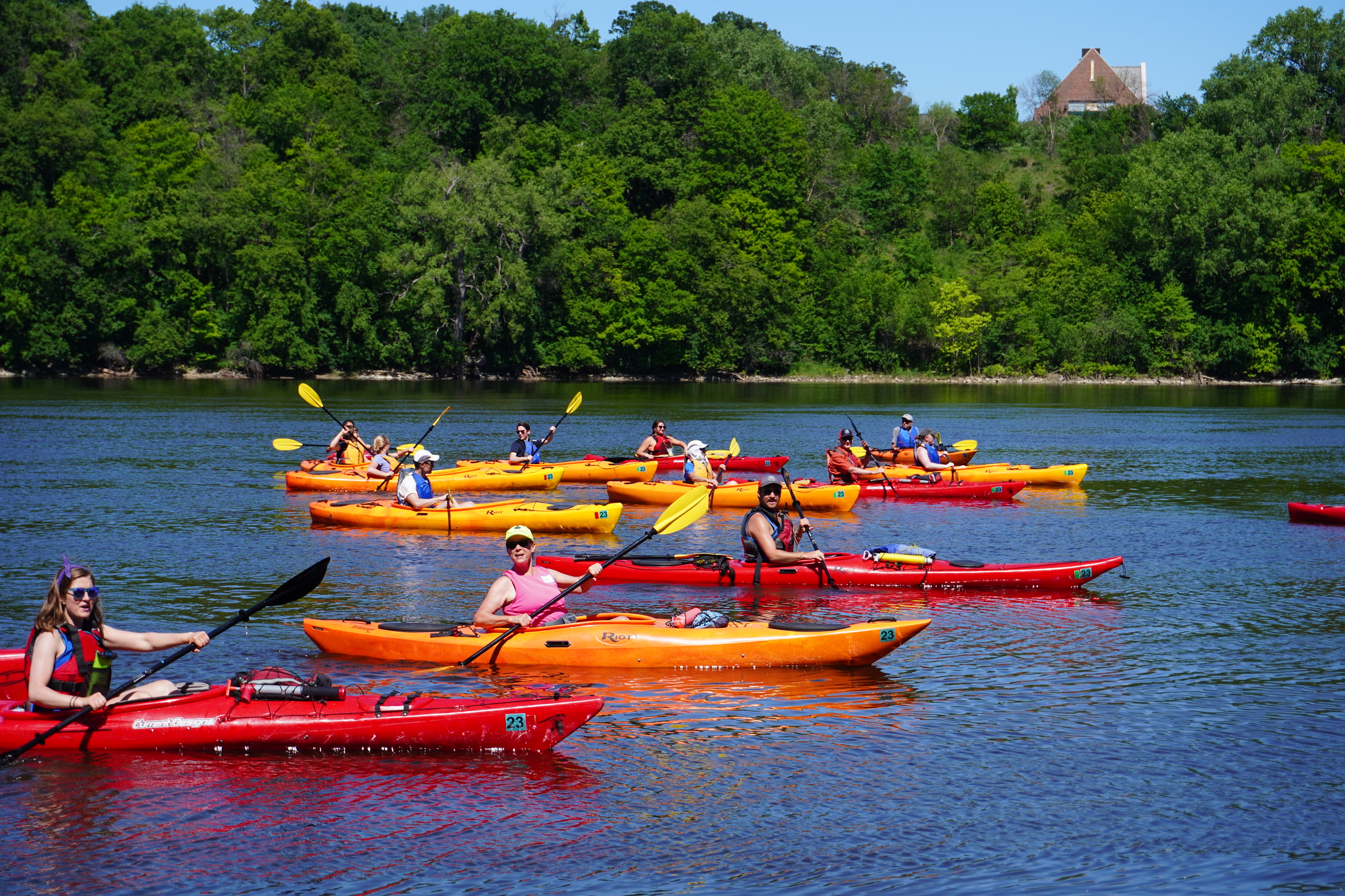 People paddling kayaks in the river