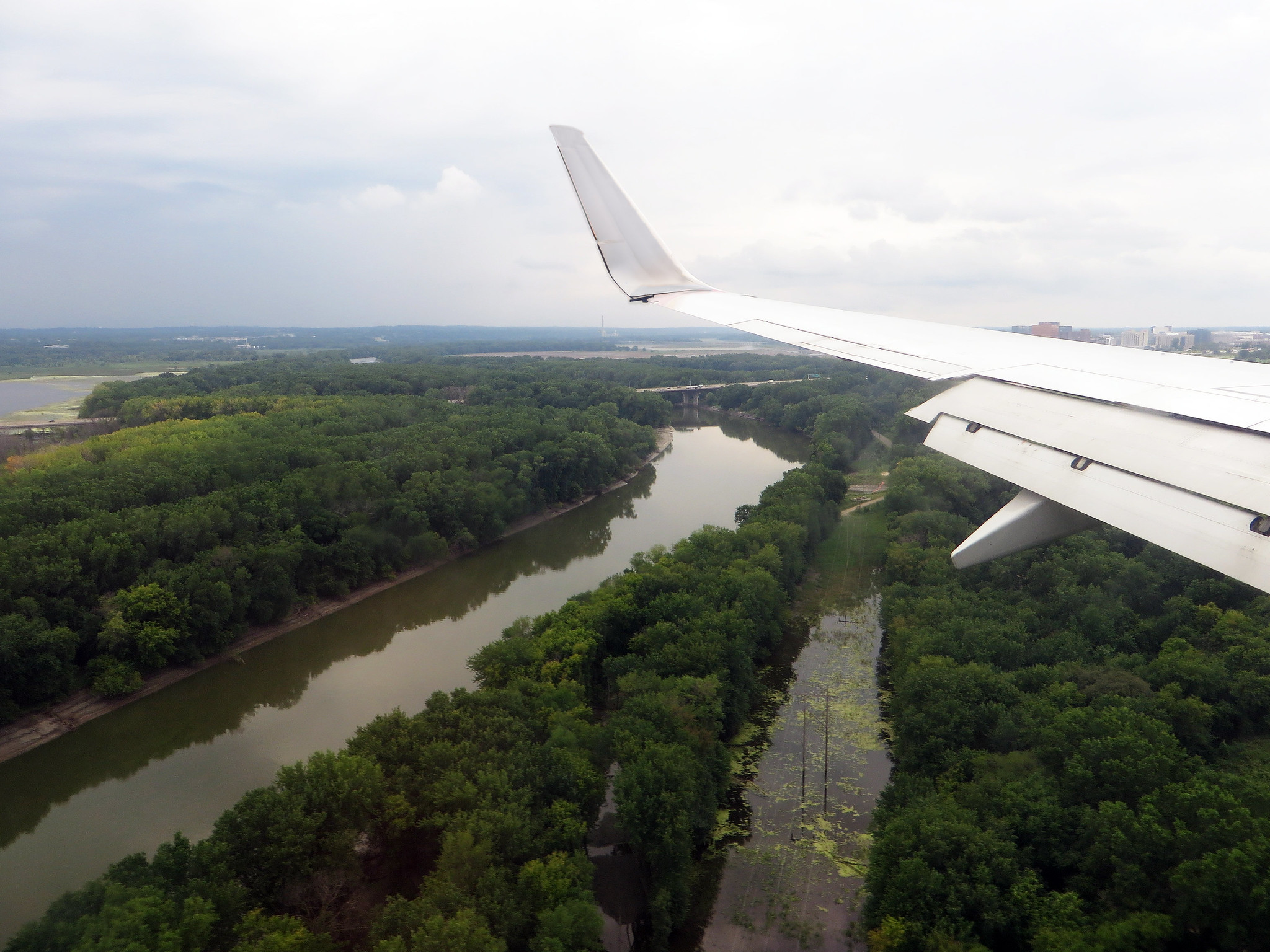 Airplane wing over river