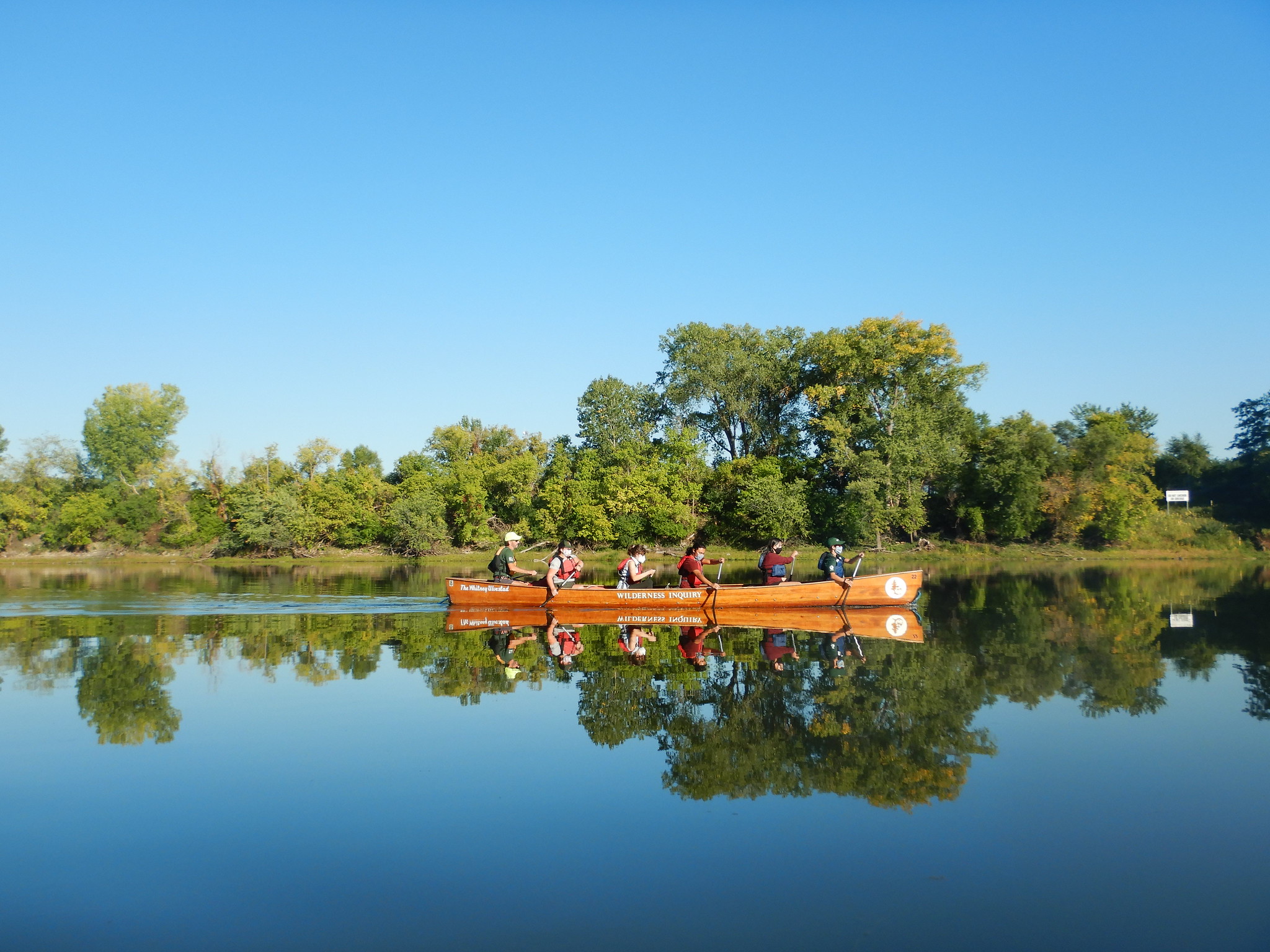 ESI members in canoe on the river