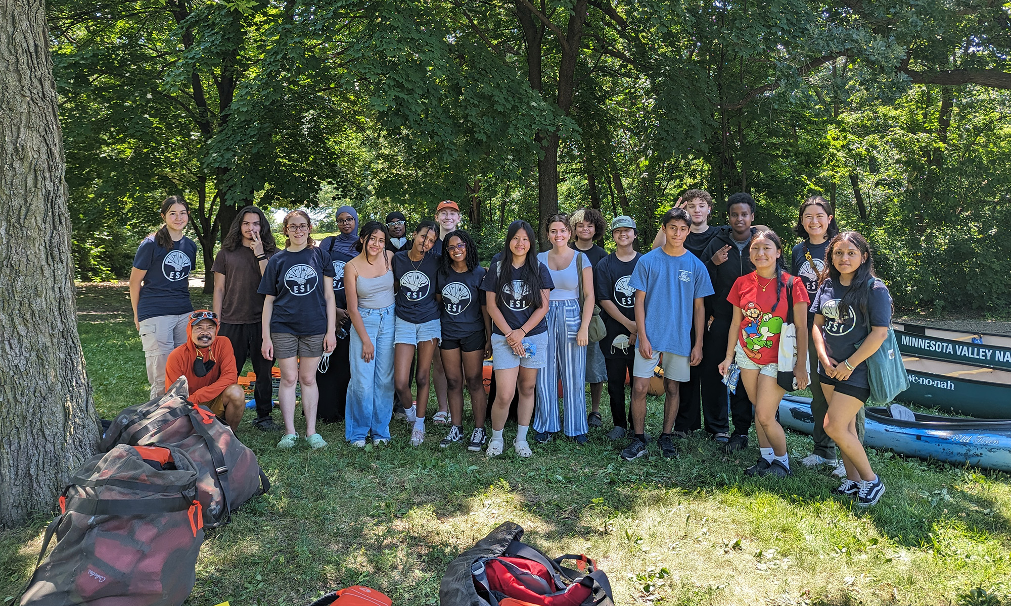 Summer ESI group photo 2025 ESI fellows by canoes