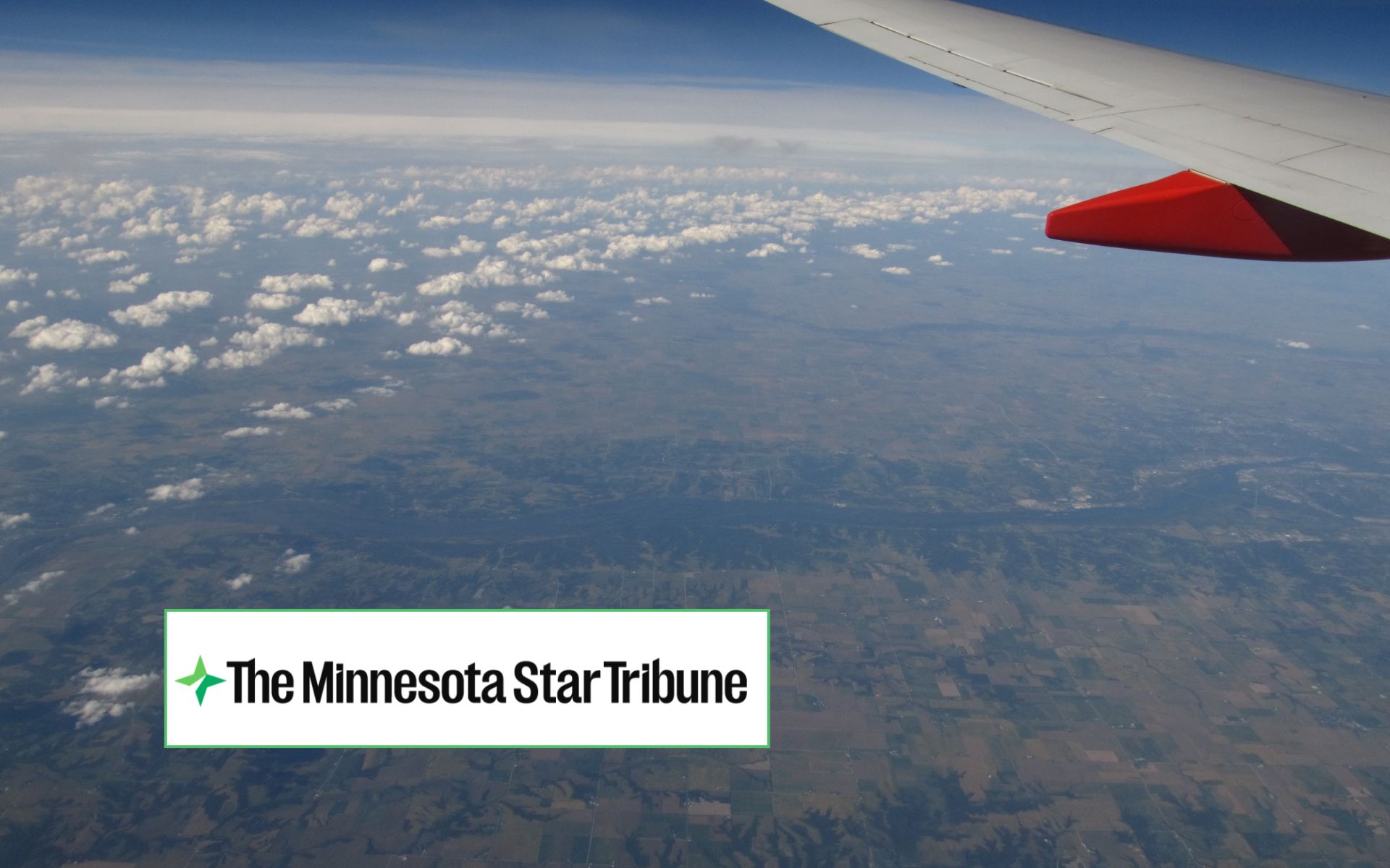 Plane and Strib Plane wing over river + The Minnesota Star Tribune