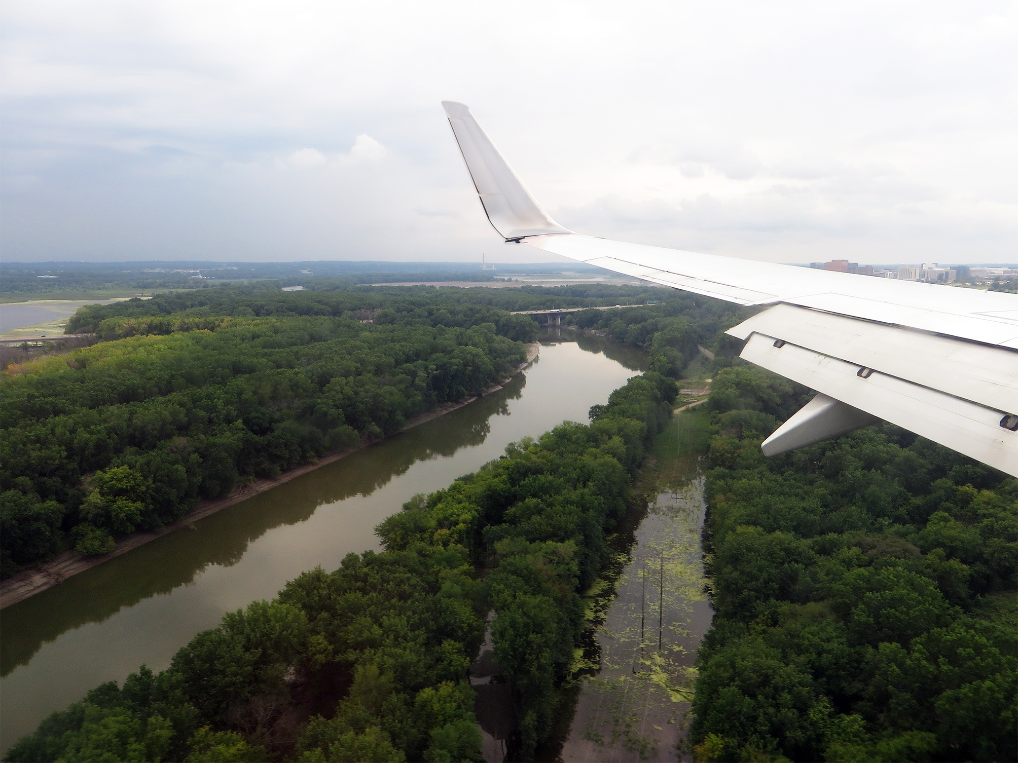 Looking out of an airplane window at Fort Snelling State Park, and the confluence of the Minnesota plus Mississippi rivers. 