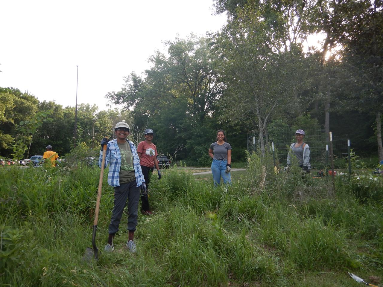 Volunteers tend the prairie at Crosby Farm Park