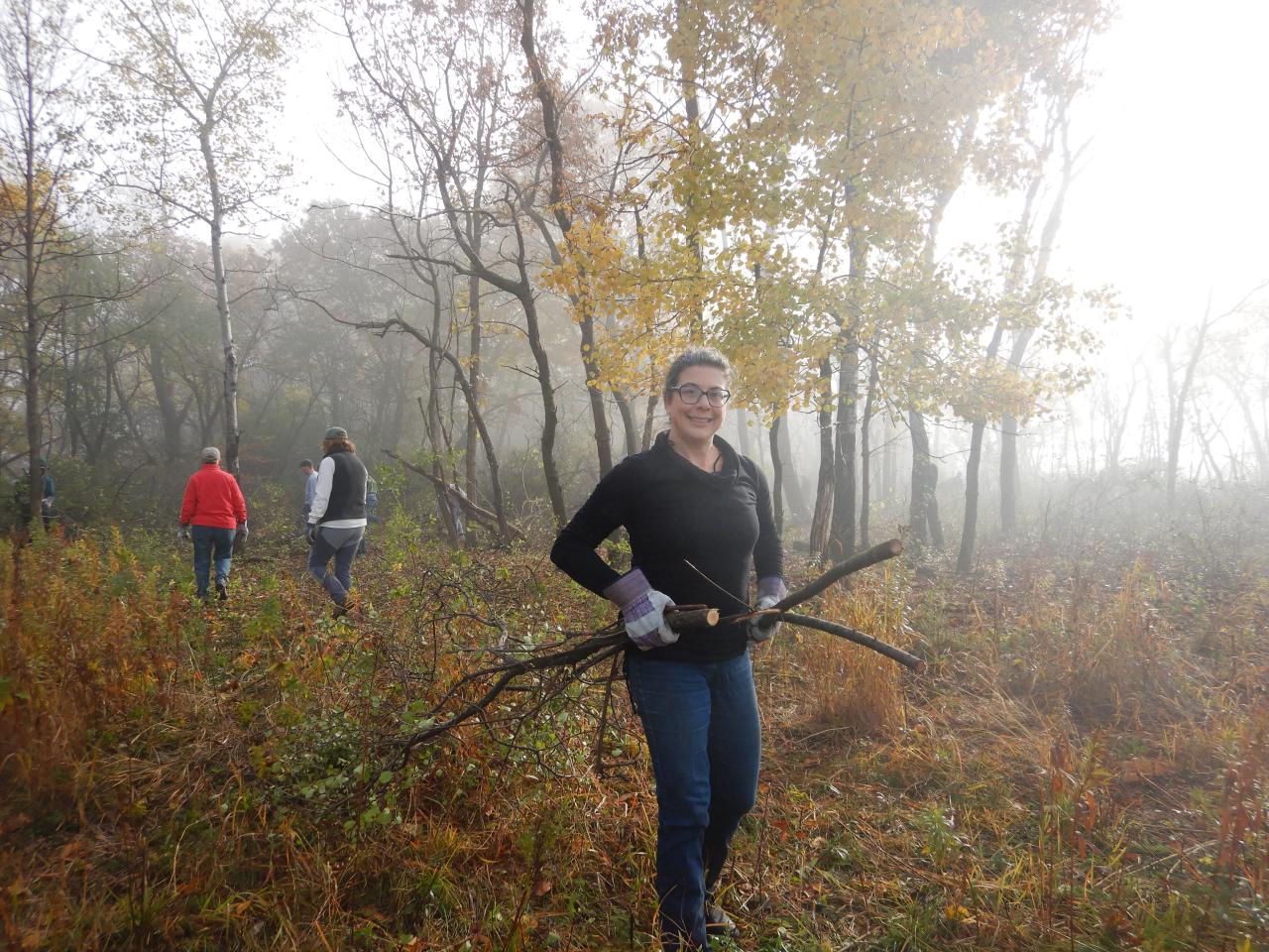 Volunteer Esther hauls brush at the 2021 event