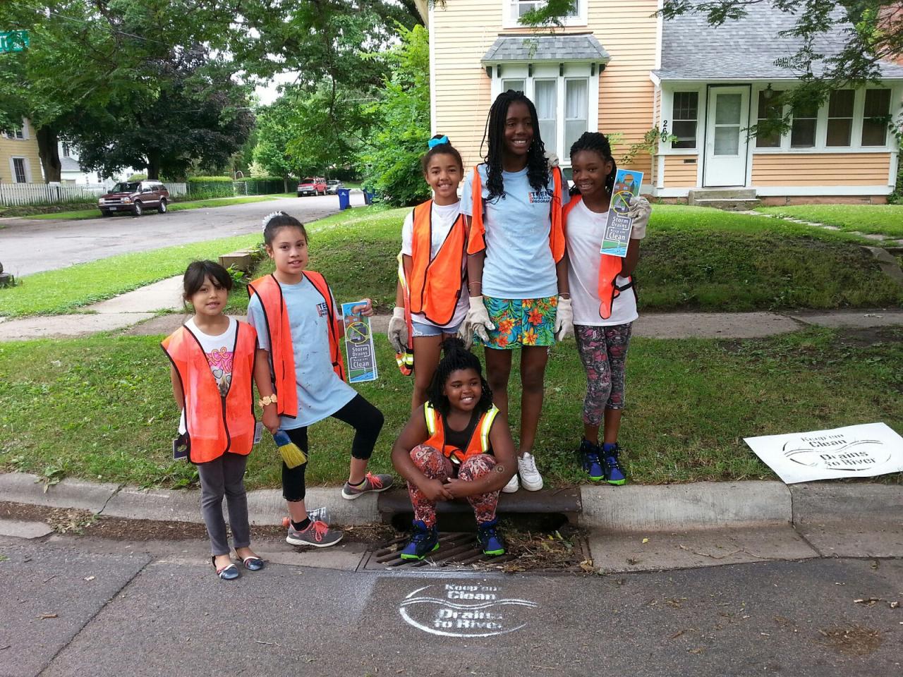 Students stencil storm drains in St. Paul neighborhoods