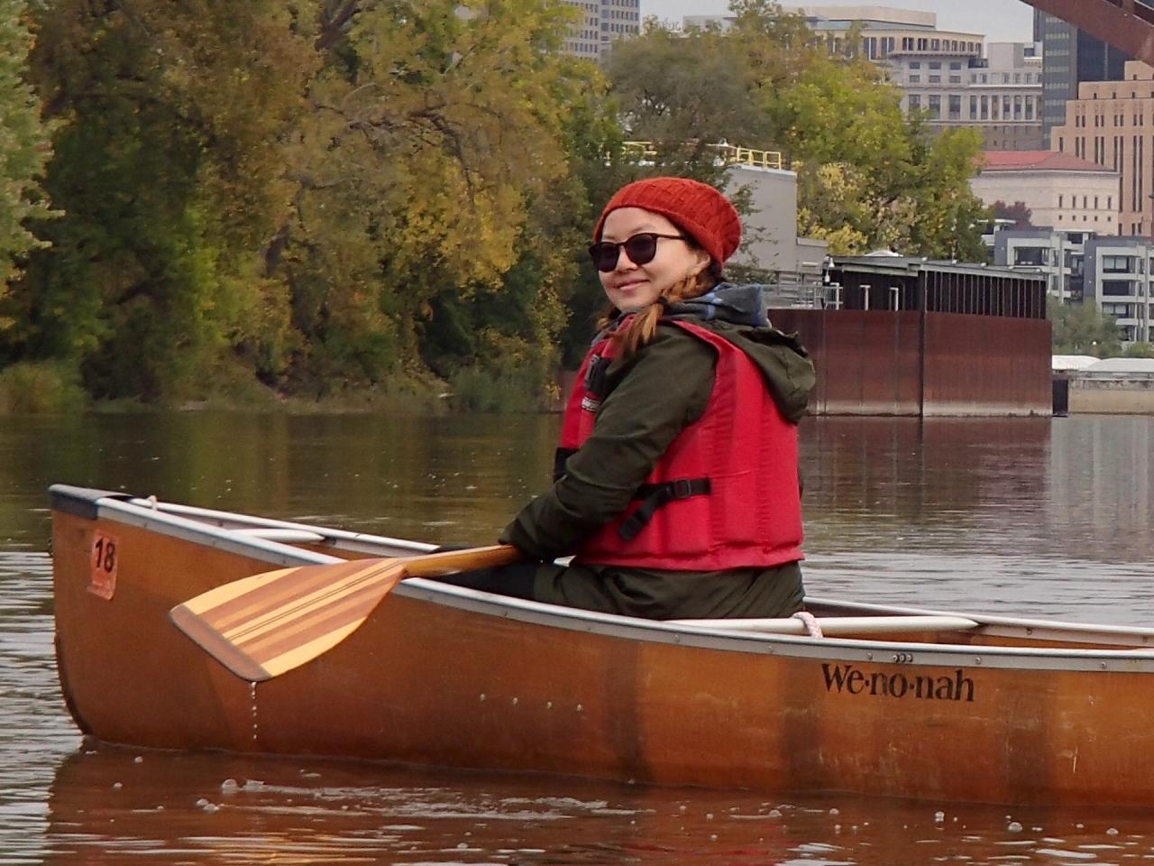 Linda Moua paddling the Mississippi River