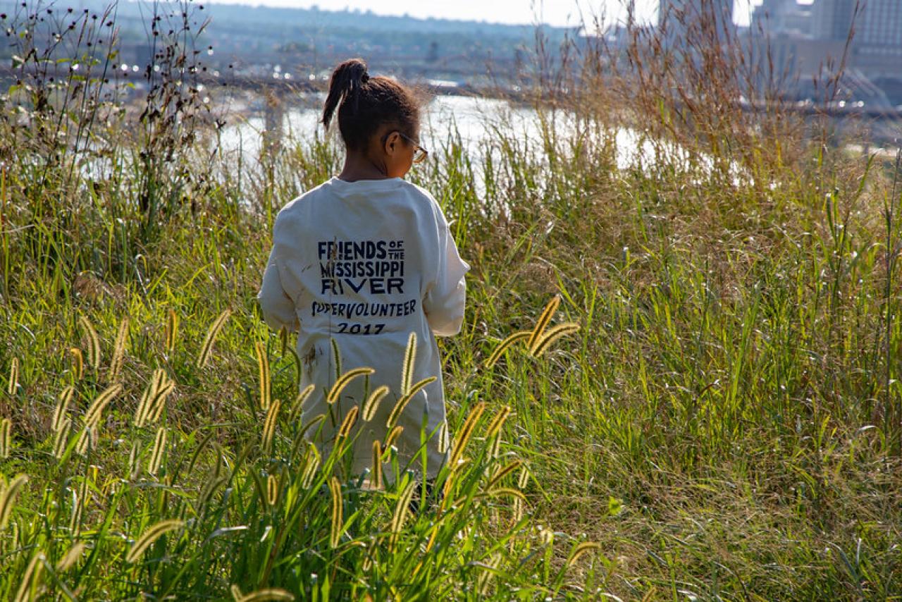 A young volunteer on the bluff at Indian Mounds Park