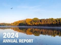2024 Annual Report cover River with trees and bird