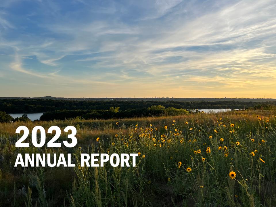 2023 Annual Report - Grey Cloud Dunes sunset over the river
