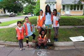 Students stencil storm drains in St. Paul neighborhoods