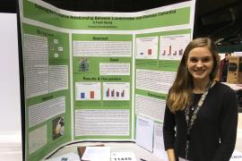 Flannery Enneking-Norton stands with her award-winning project at this month's Twin Cities Regional Science Fair. 