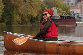 Linda Moua paddling the Mississippi River