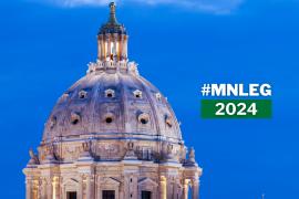 The dome of the Minnesota Capitol building, seen in front of an evening blue sky. Text says "MNLEG 2024."