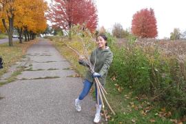 A student from Harding High Earth Club at the prairie at Mounds Park