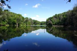 Seidl's Lake, blue surrounded by green forest