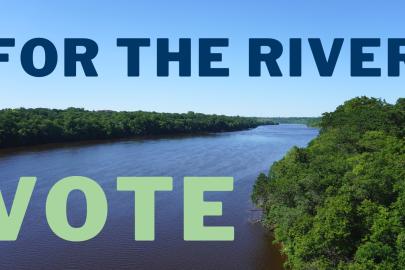 An aerial photo of the Mississippi River. Text along the top says "For the river." Text in the bottom lift says "Vote."