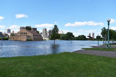 Floodwaters encroach on buildings and paths at St. Paul's Harriet Island.