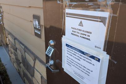 A sign on a USFWS bathroom door saying it is closed due to the federal shutdown.