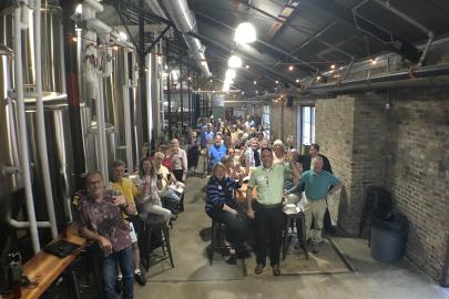 River Guardians Happy Hour attendees toasting the 2017 legislative session