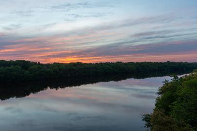 river and forests at sunset