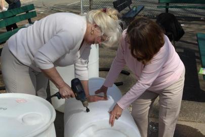 Workshop participants building their rain barrel