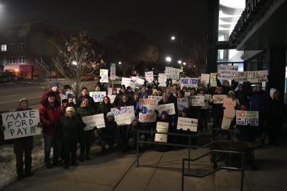 Ford Area C rally group with signs