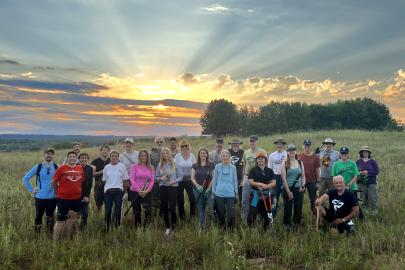Volunteers in front of sunset