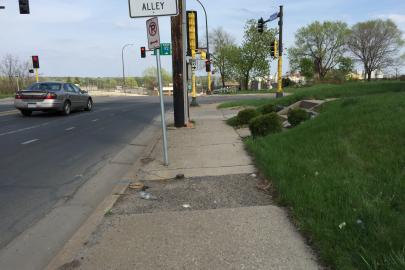N Dowling Avenue sidewalk three blocks from the river
