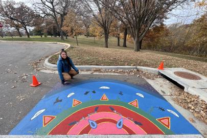 Artist Graci Horne with the completed mural