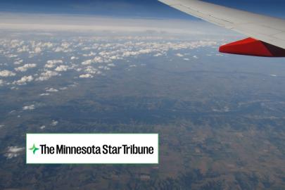 Plane wing over river + The Minnesota Star Tribune