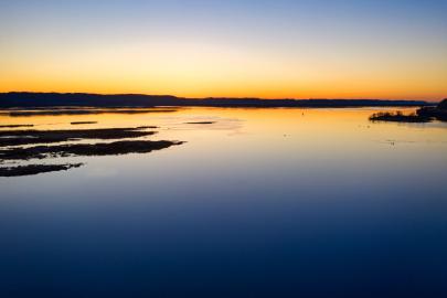A blue and golden sky as the sun sets over the Mississippi River in Minneiska, Minnesota.