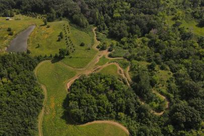 Aerial view of trail, water, forest