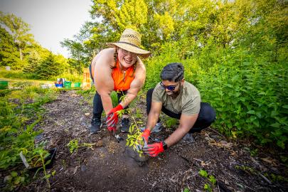 Two volunteers plant at a 2021 FMR event
