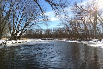 Open river with snow along the banks