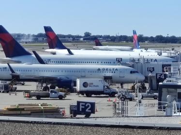 Delta planes lined up at various gates at MSP Airport.