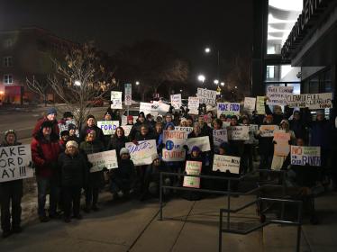 Ford Area C rally group with signs