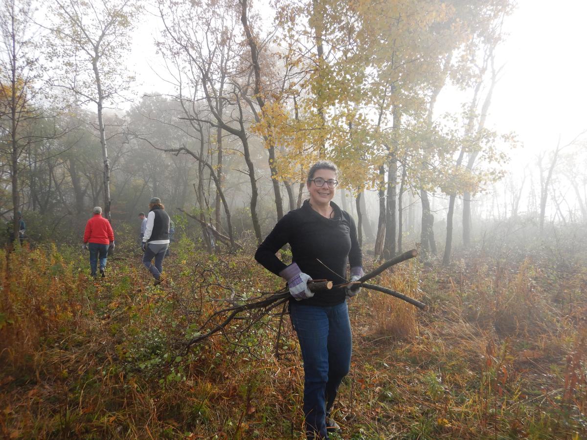 Volunteer Esther hauls brush at the 2021 event