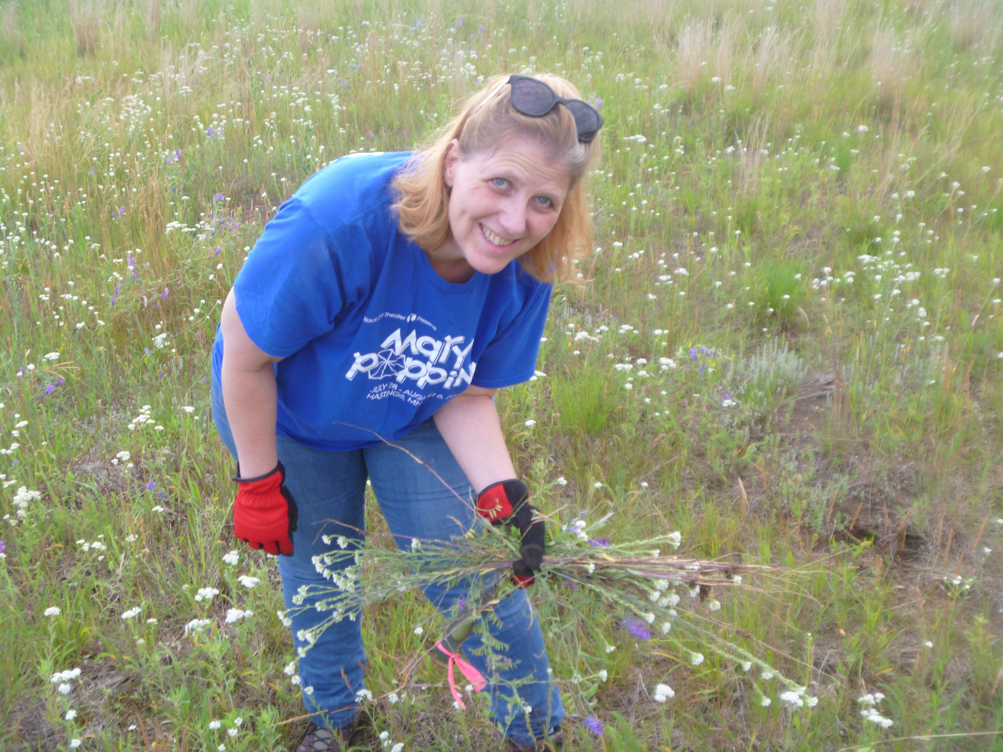 A volunteer tends a prairie