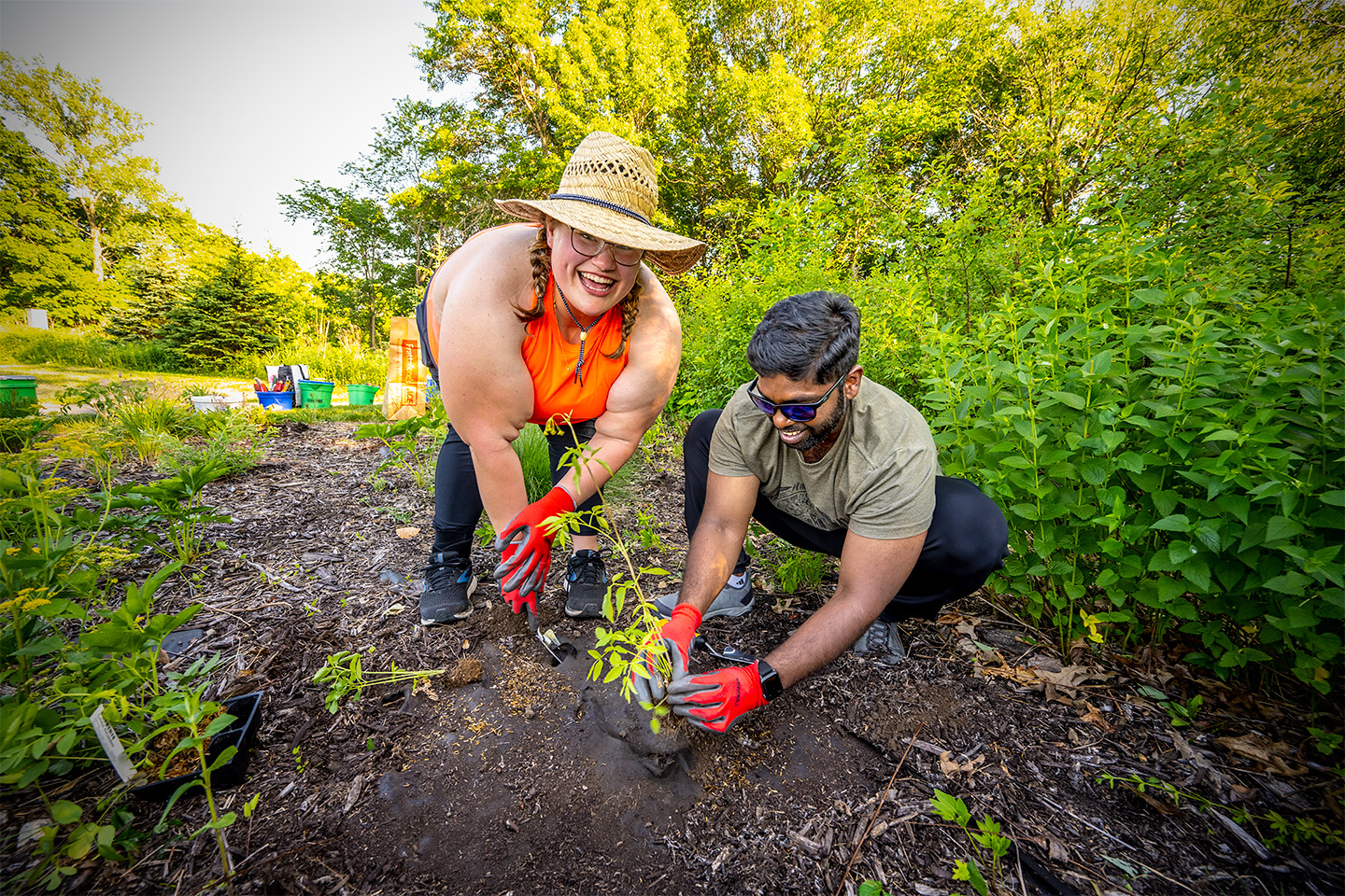 Two volunteers plant at a 2021 FMR event