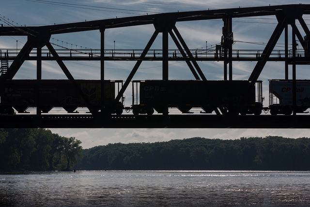 Train silhouette over the river in Hastings by Tom Reiter