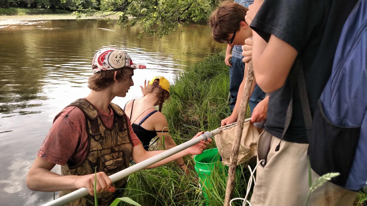 Elk River High School students at the edge of the river.