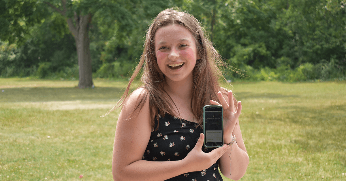 Fiona with her website on a phone