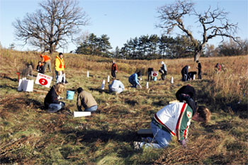 [Photo: Volunteers planting acorns at the Flint Hills Resources property.]