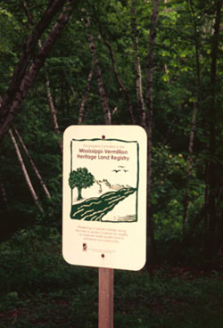 [Photo: Mississippi-Vermillion Heritage Land Registry sign posted on an enrolled property.]