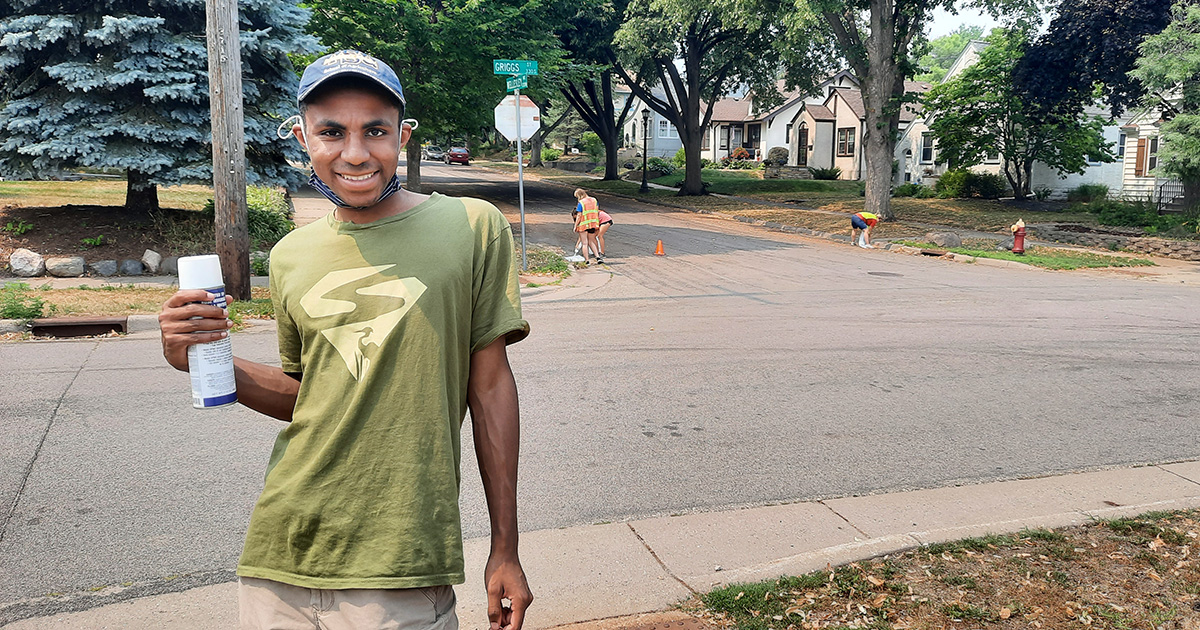 Marcellus wears his SuperVolunteer shirt and smiles