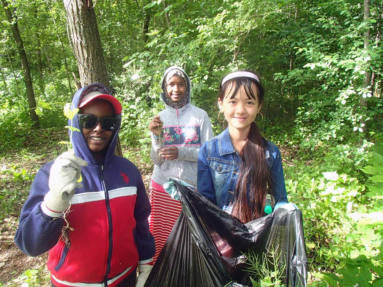 Students pull garlic mustard from area park Students remove garlic mustard from the Mississippi River gorge in Minneapolis