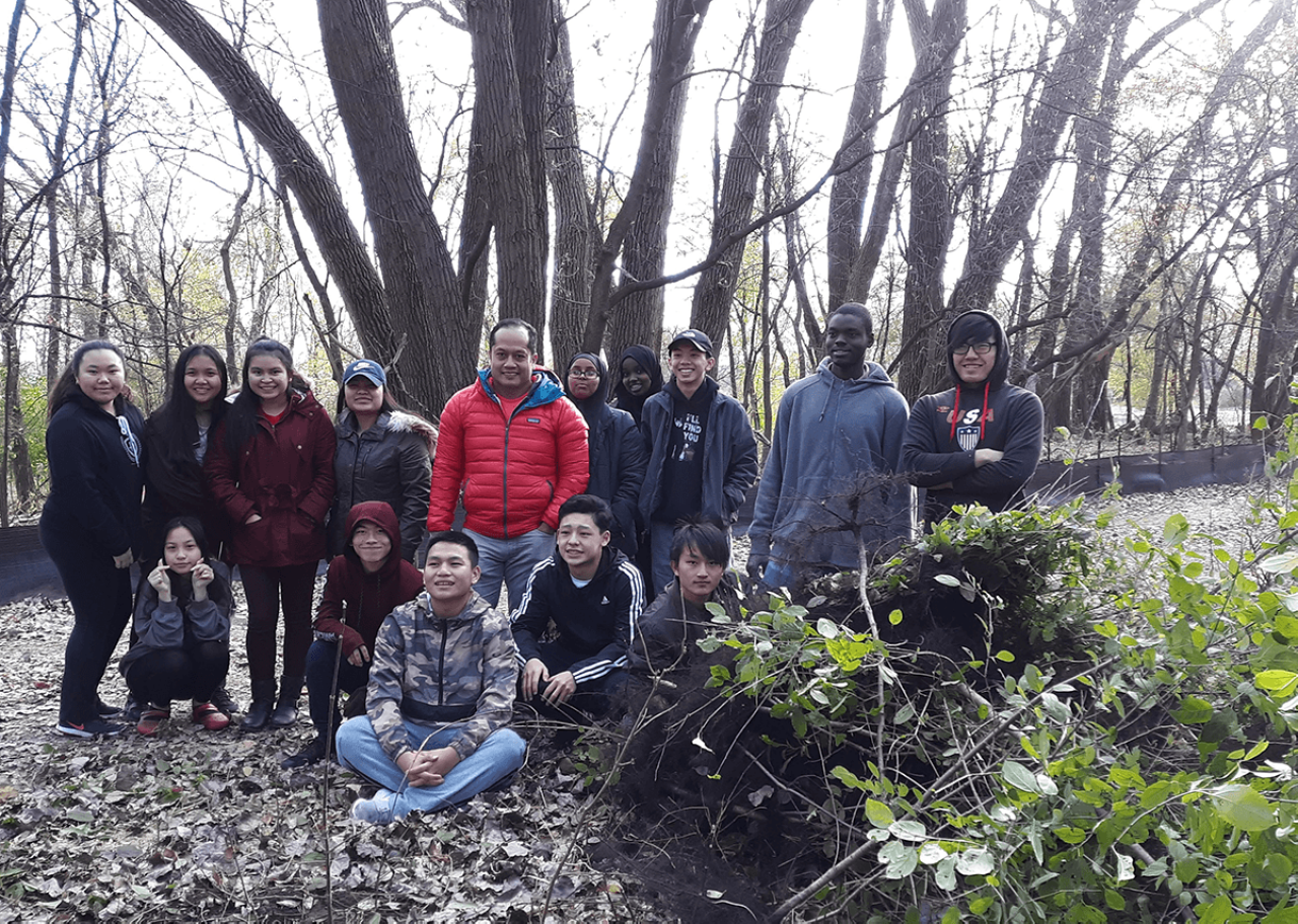 High School students assist FMR staff with removing buckthorn an invasive species at a restoration site High School students assist FMR staff with removing buckthorn an invasive species at a restoration site
